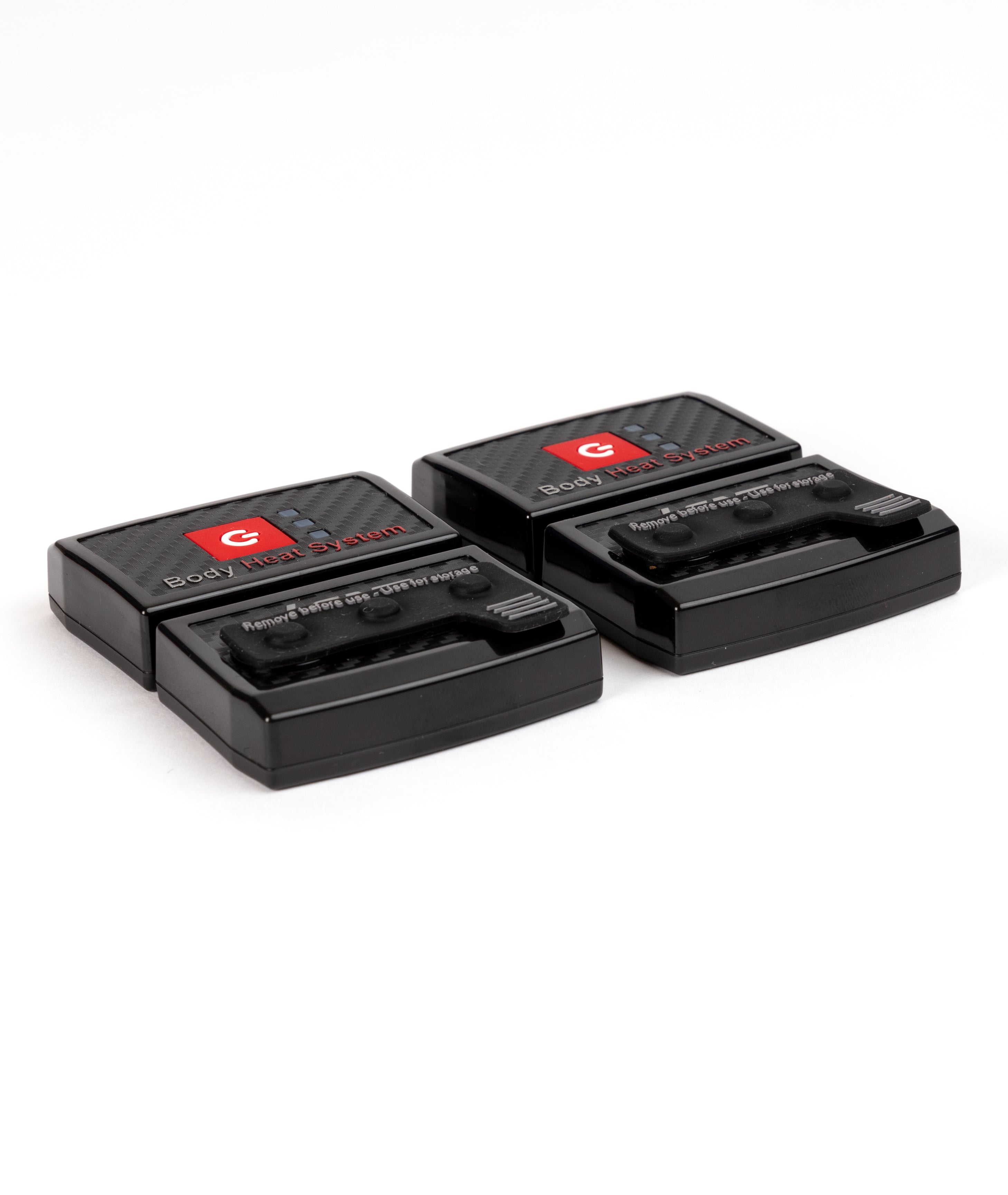 Two black LENZ rcB 1400 battery packs with carbon Body Heat System fronts and storage caps fitted, top view