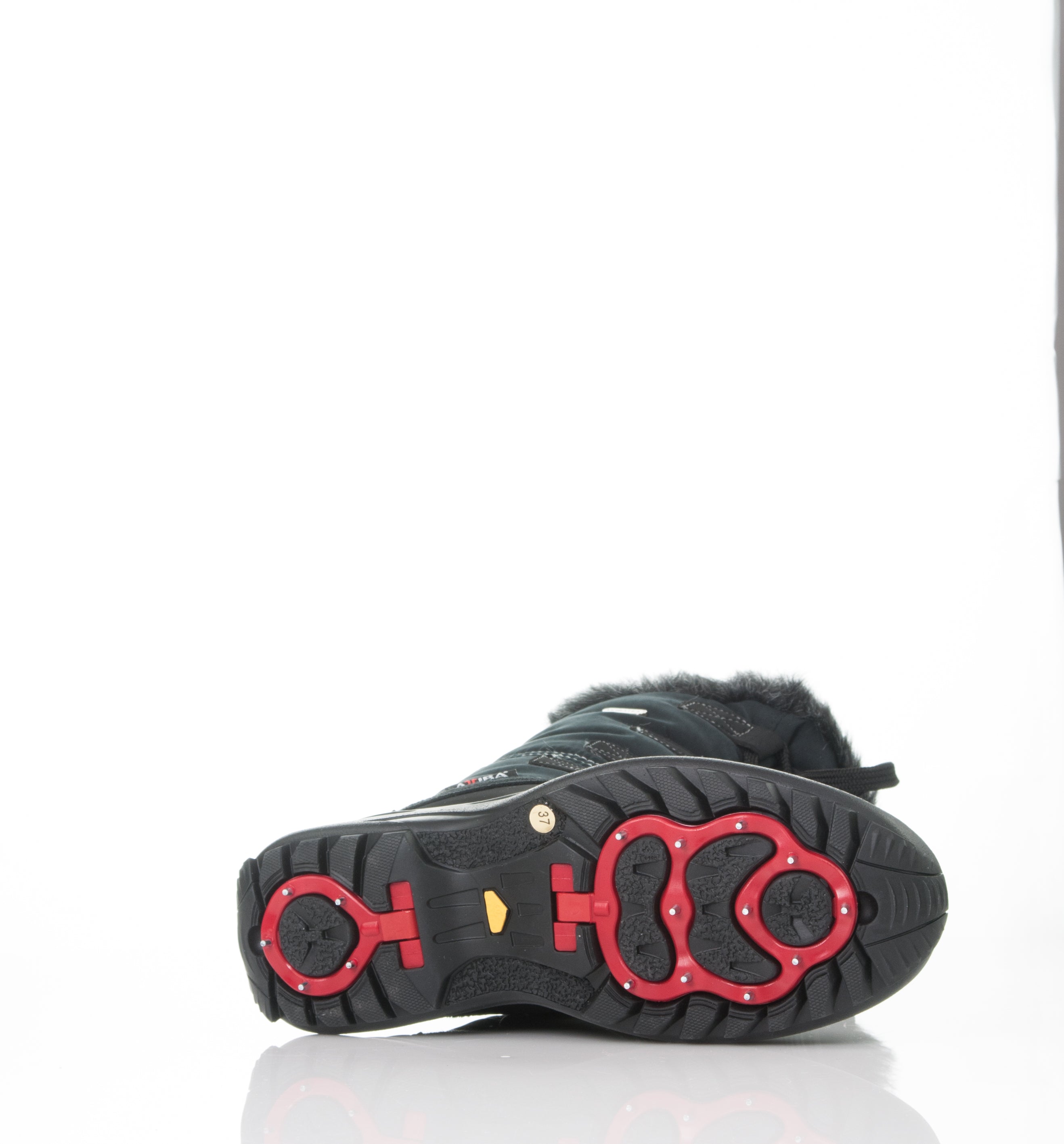Attiba Florence Women’s Après Boot sole with retractable ice traction spikes deployed for snow and ice