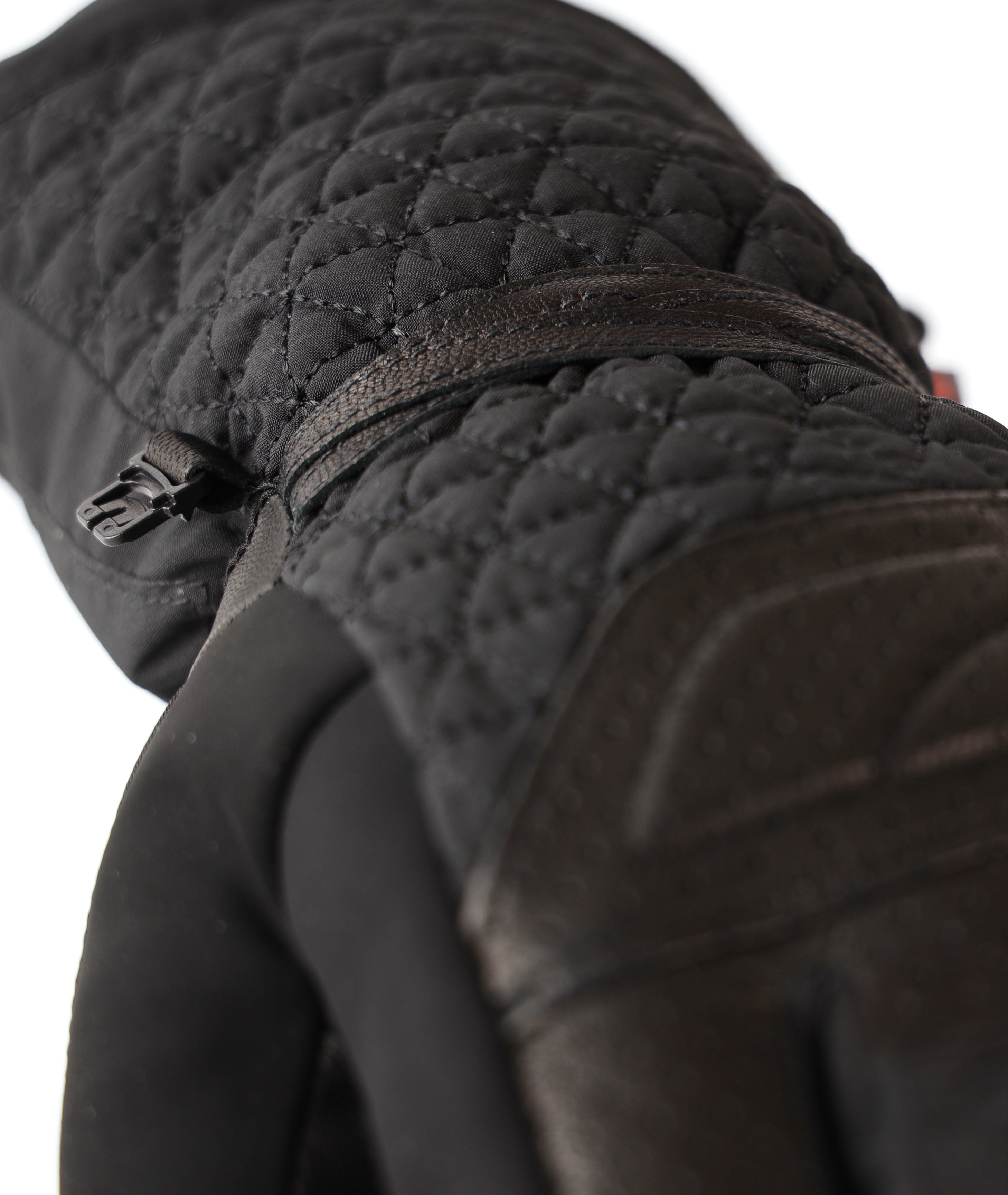 Black LENZ Heat Glove 6.0 heated glove quilted gauntlet cuff with zip pull, close-up detail