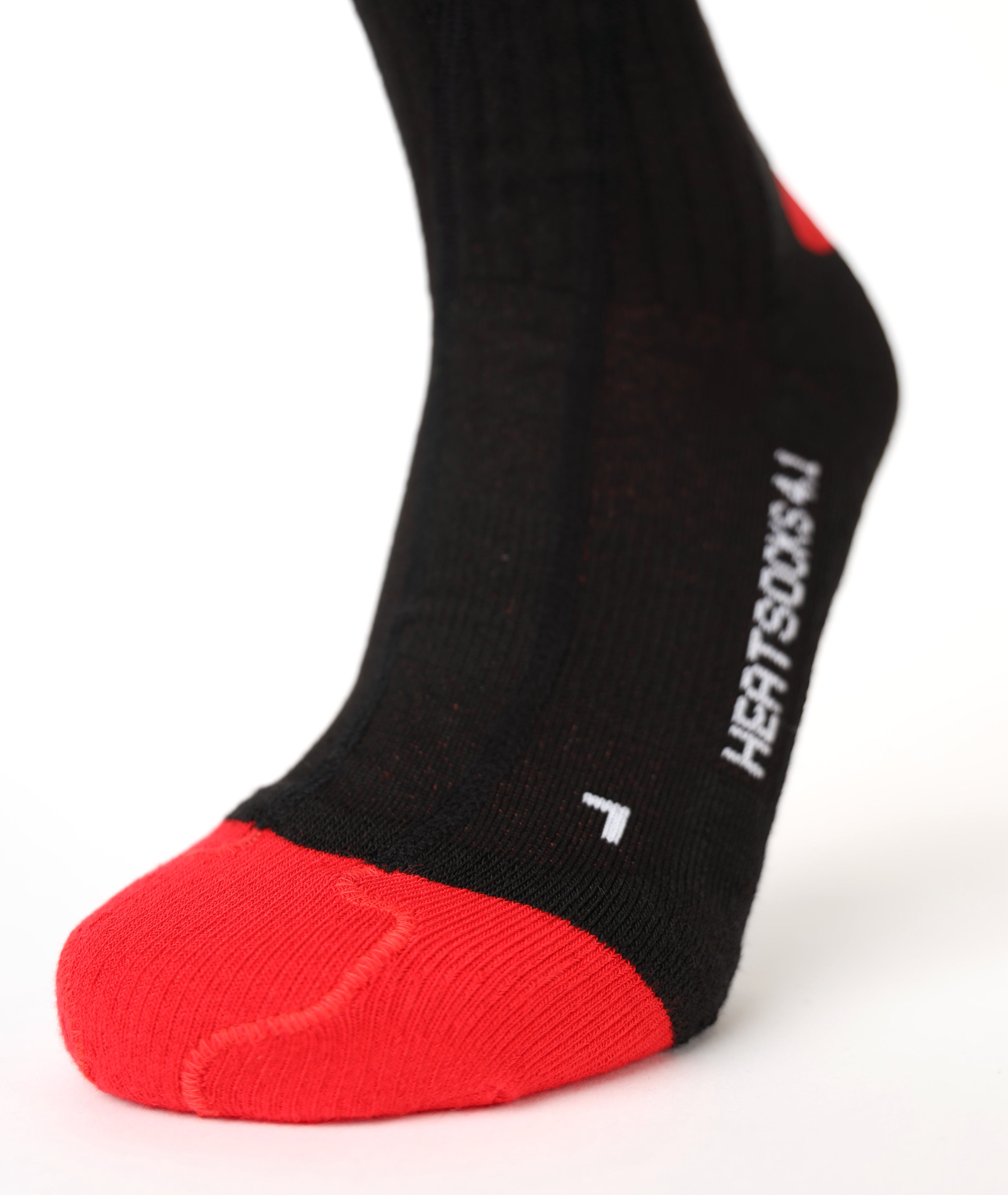 Close-up of the black LENZ Heat Sock 4.1 foot showing the red reinforced toe and HEATSOCKS 4.1 text