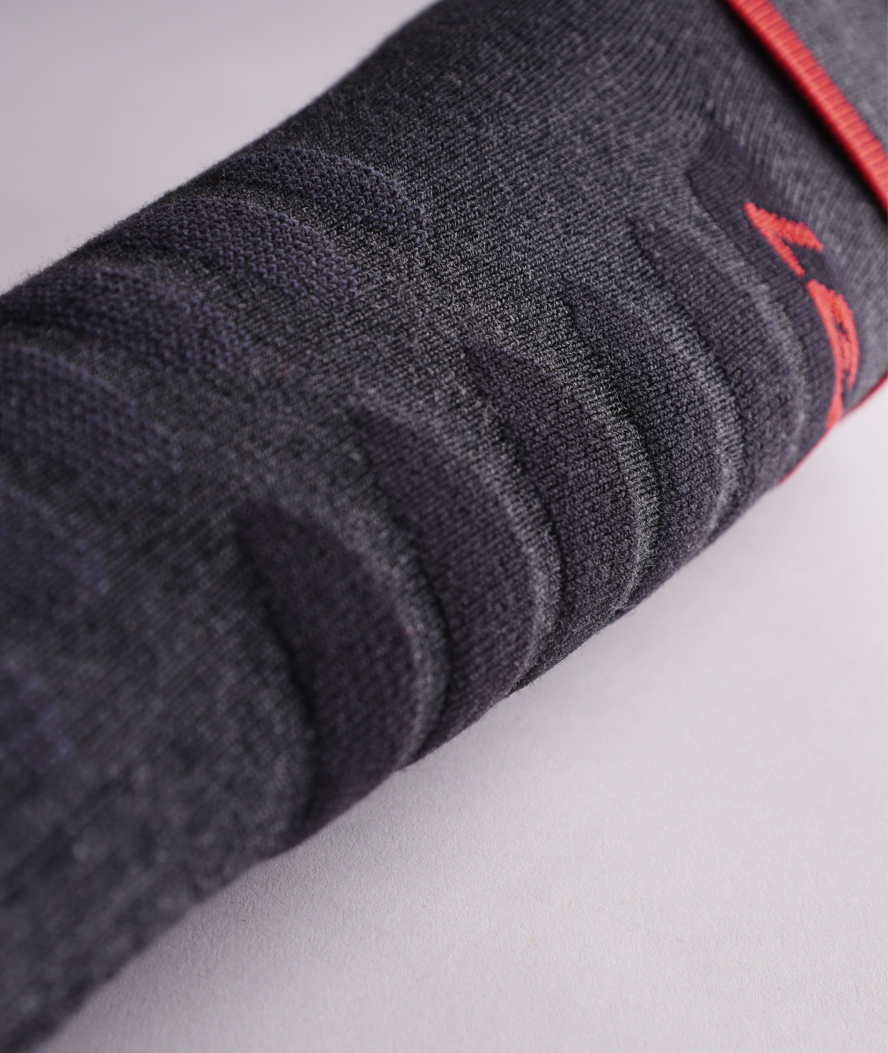 Black LENZ Heat Sock 6.1 heated ski sock ribbed knit leg fabric, close-up