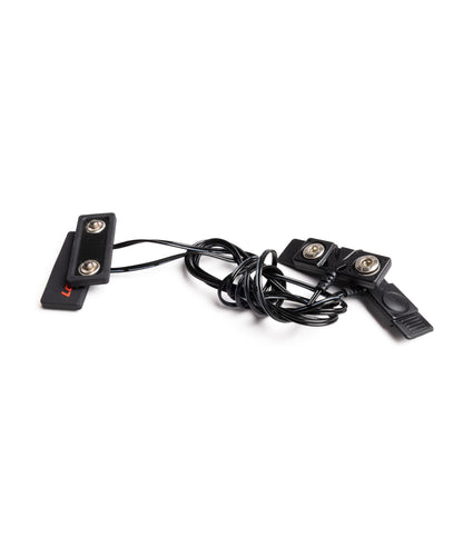 Back view of the LENZ heat sock battery extension cable showing the snap-button connectors and coiled cord