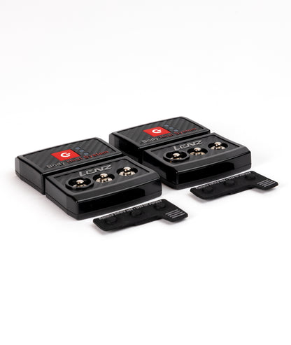 Two black LENZ rcB 1400 battery packs showing three press-stud connectors each, with storage caps, angled view