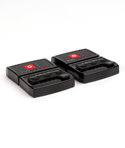 Two black LENZ rcB 1400 battery packs with carbon Body Heat System fronts and storage caps fitted, top view