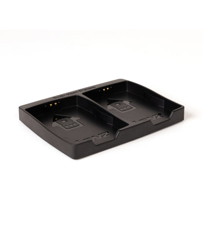 Black Lenz rcB 2000 twin charging cradle showing contact pins in both bays, angled view
